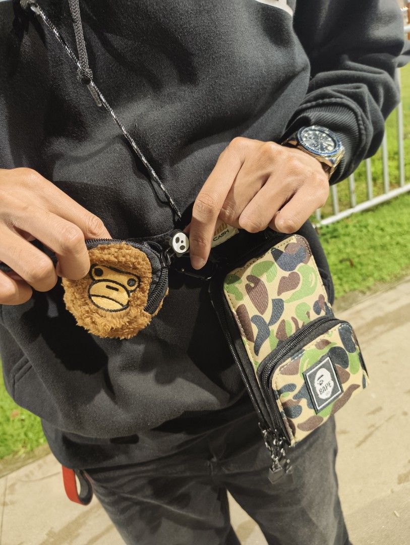 BAPE Camo Crossbody Bag with Wallet (Category: Luxury Bags & Wallets) located in Manila. Submitted by luh_markus (Listing ID 1406515363, Image 3). Description: 🎉Lowest in the market 🎉 - BAPE Crossbody Bag - Camo Pattern - Multiple card holder - Detachable Wallet Included - Small Backpack Design - BAPE Logo Patch - Includes Ape Head Coin Purse - Long Crossbody Strap - Multiple Compartments ‼️699 only plus sf‼️ Meet ups: Imus, Cavite only 💢 Cour
