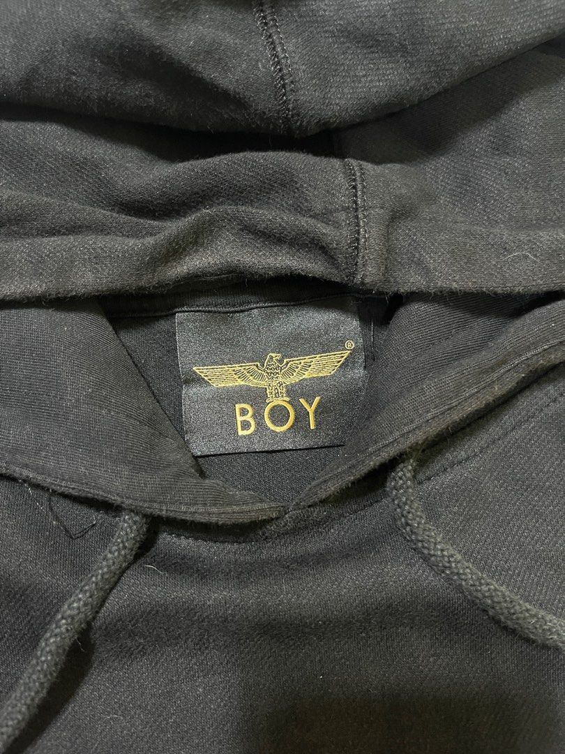 Boy London Hoodie Black (Category: Hoodies) located in Caloocan City. Submitted by yungbluhh (Listing ID 1406513203, Image 3). Description: - Boy London black hoodie - Size: L - Features: - Front pocket - Hood with drawstrings - BOYZ design on front - Eagle design with brand name on back - Made with soft, comfortable material.