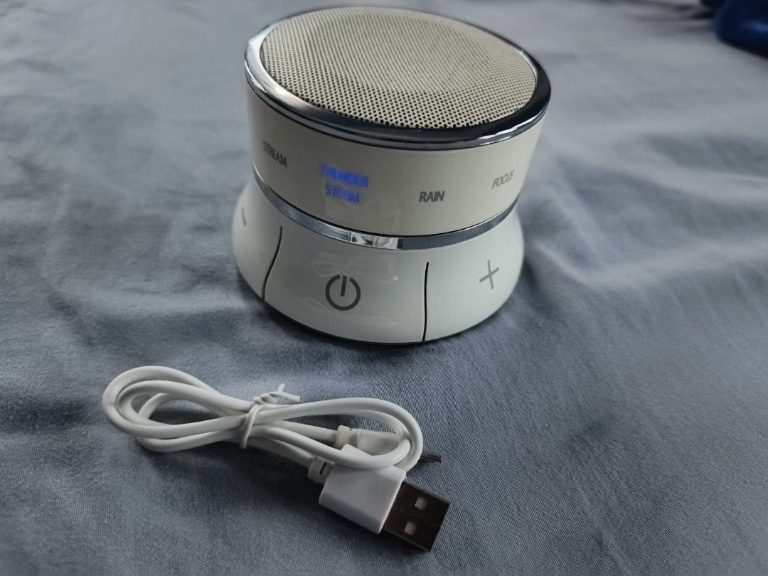 Brookstone Wireless Bluetooth Speaker (Category: Soundbars, Speakers & Amplifiers) located in Santa Ana. Submitted by lowerbasement (Listing ID 1406522146, Image 1). Description: - Brookstone Wireless Bluetooth Speaker - Sound Options: White noise, brown noise, rain, thunderstorm - Connectivity: Bluetooth and AUX input - Includes USB charging cable - Features power button and volume controls - Brookstone branding and model information on the bott