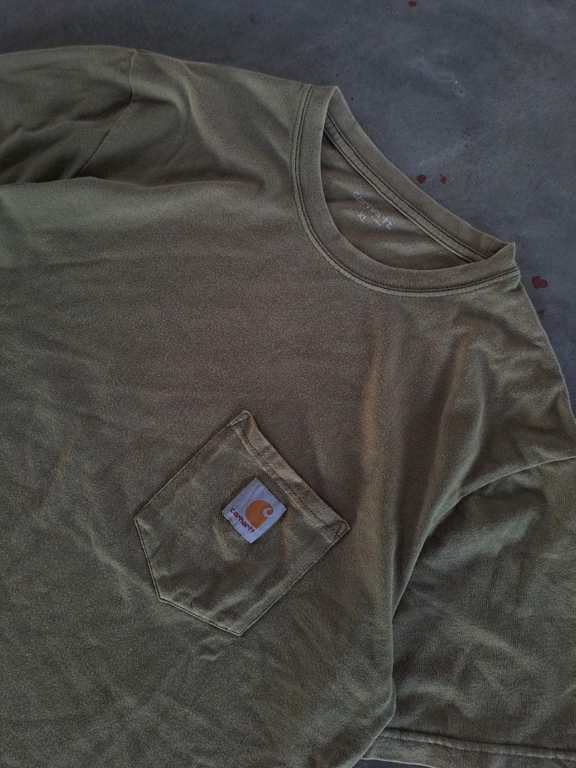 CARHARTT MOSS GREEN WIP POCKET TEE (Category: Activewear) located in Hagonoy. Submitted by favelagmay (Listing ID 1406467808, Image 3). Description: 28 x 22 color rate 9 slight stain.