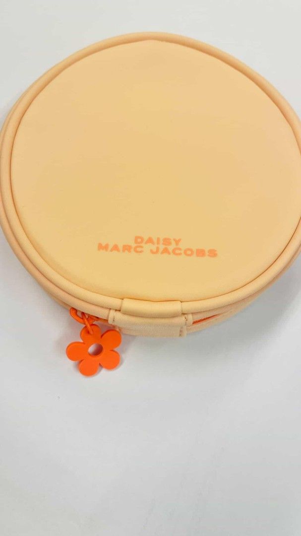 Daisy Marc Jacobs Cosmetic Pouch (Category: Luxury Bags & Wallets) located in Valenzuela. Submitted by aliehs.alo (Listing ID 1406477562, Image 3). Description: - Round cosmetic pouch - Daisy Marc Jacobs logo on front - Two zippered compartments -this was included when my friend bought a perfume.