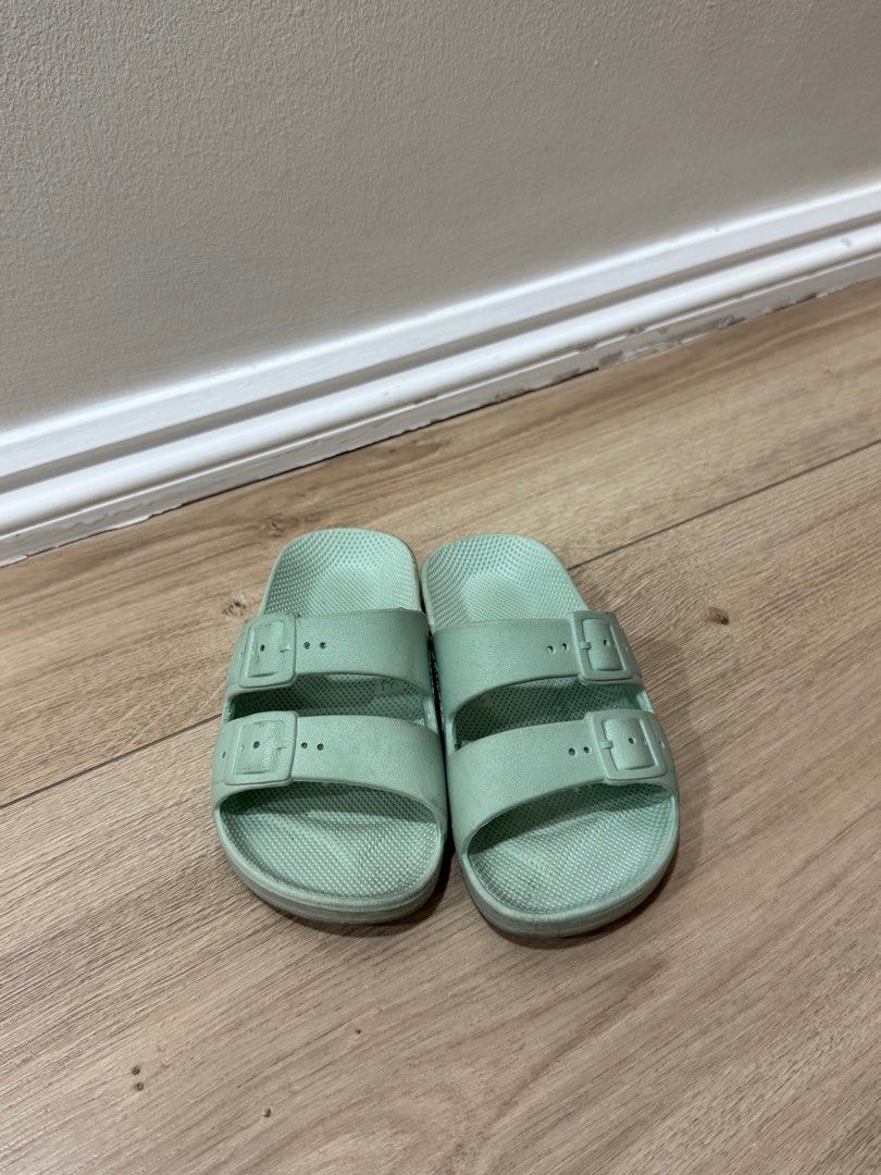 Freedom Moses slippers - Size 24/25 (Category: Babies & Kids Fashion) located in Paranaque City. Submitted by rymss (Listing ID 1406568341, Image 1). Description: Mint green Moses sandals. Features two adjustable straps with buckles. The sandals have a textured footbed. Size is indicated as 24/25. Perfect for casual wear..