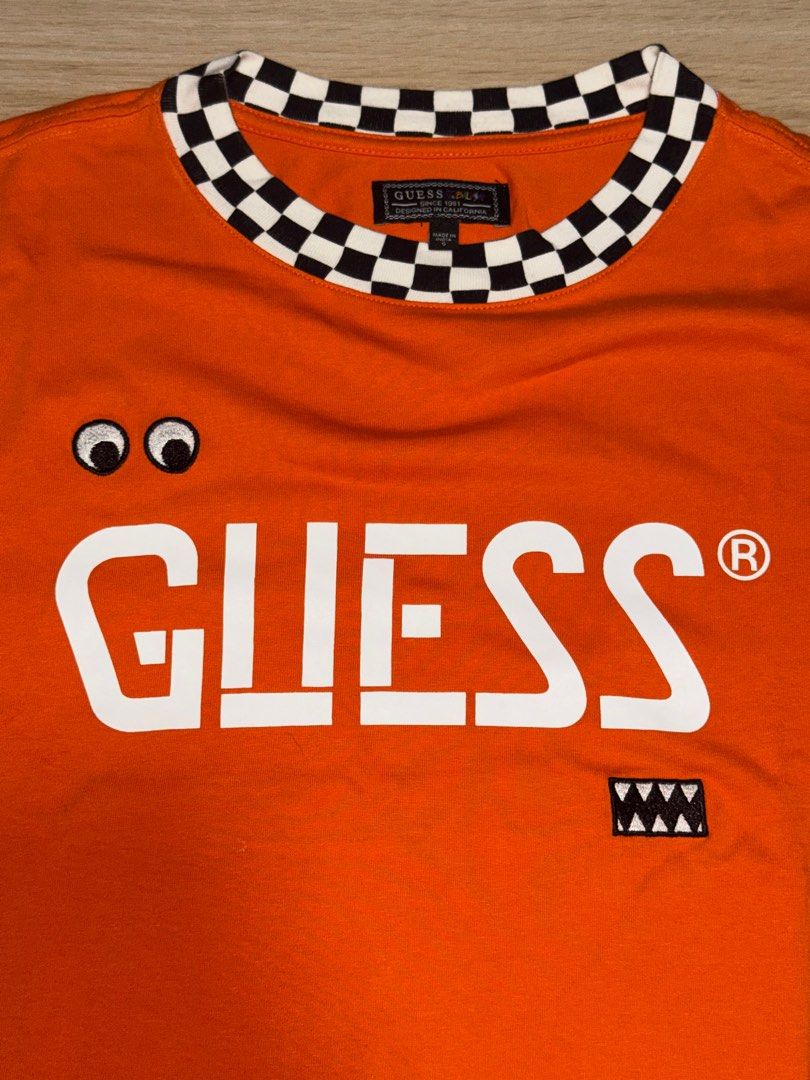 Guess x J Balvin T-shirt (Category: Tshirts & Polo Shirts ) located in Antipolo. Submitted by drren_ (Listing ID 1406566817, Image 2). Description: - Orange Guess T-shirt - J Balvin Collaboration - Size S - W:22 L:29 - 10/10 Condition - Used Once .