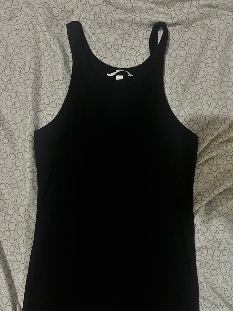 H&M Black Sleeveless Dress (Category: Dresses) located in Manila. Submitted by jashdeclutters (Listing ID 1406621333, Image 3). Description: - H&M black sleeveless dress - Bodycon fit - High neckline - Solid black color - Comfortable, stretchy material - Great for casual wear or layering - Simple and versatile design.