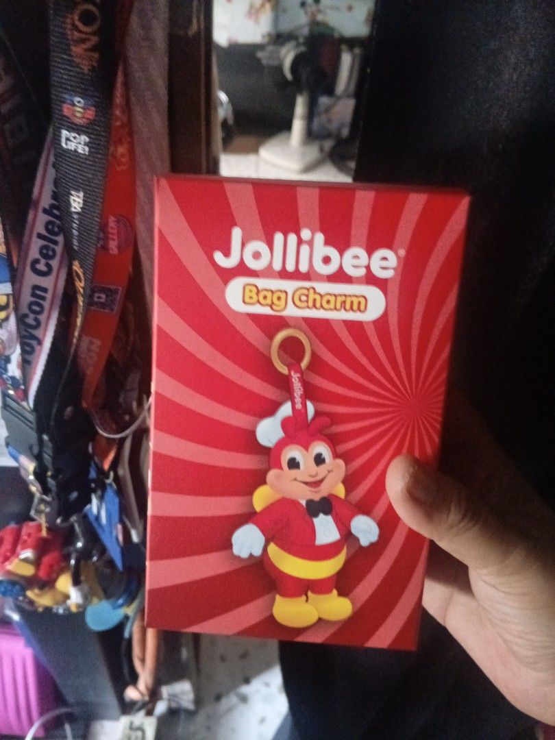 Jollibee Bag Charm (Category: Character Goods) located in Manila. Submitted by sshiro29 (Listing ID 1406498382, Image 1). Description: - Jollibee bag charm - Features the Jollibee mascot - Attached to a gold-colored ring - Comes in a red Jollibee box - Box includes "Bag Charm" text.