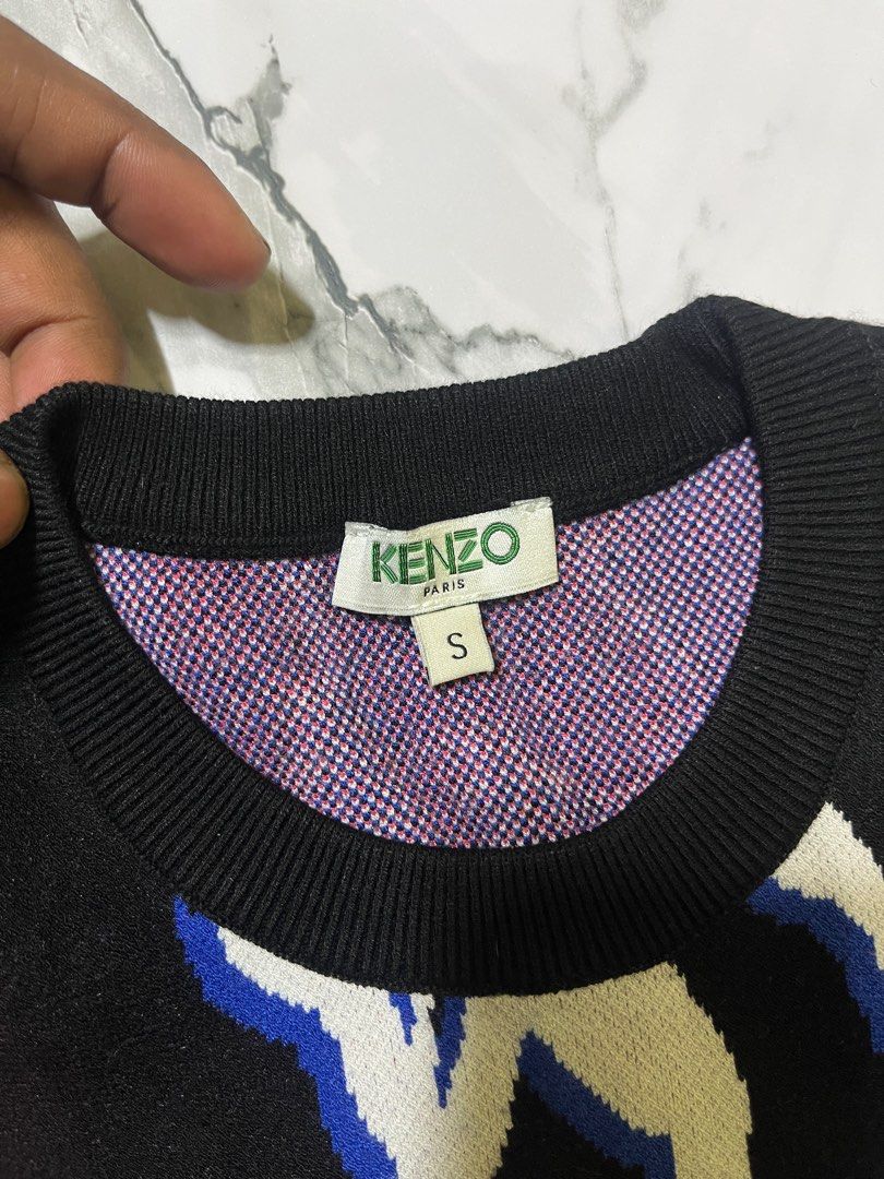 Kenzo Floral Print Sweater - S (Category: Coats, Jackets and Outerwear) located in Caloocan City. Submitted by yungbluhh (Listing ID 1406512855, Image 2). Description: - Kenzo sweater with floral print - Size: Small - Crew neck design - Long sleeves - Ribbed collar, cuffs, and hem - Interior lining with patterned design - Authentic Kenzo.