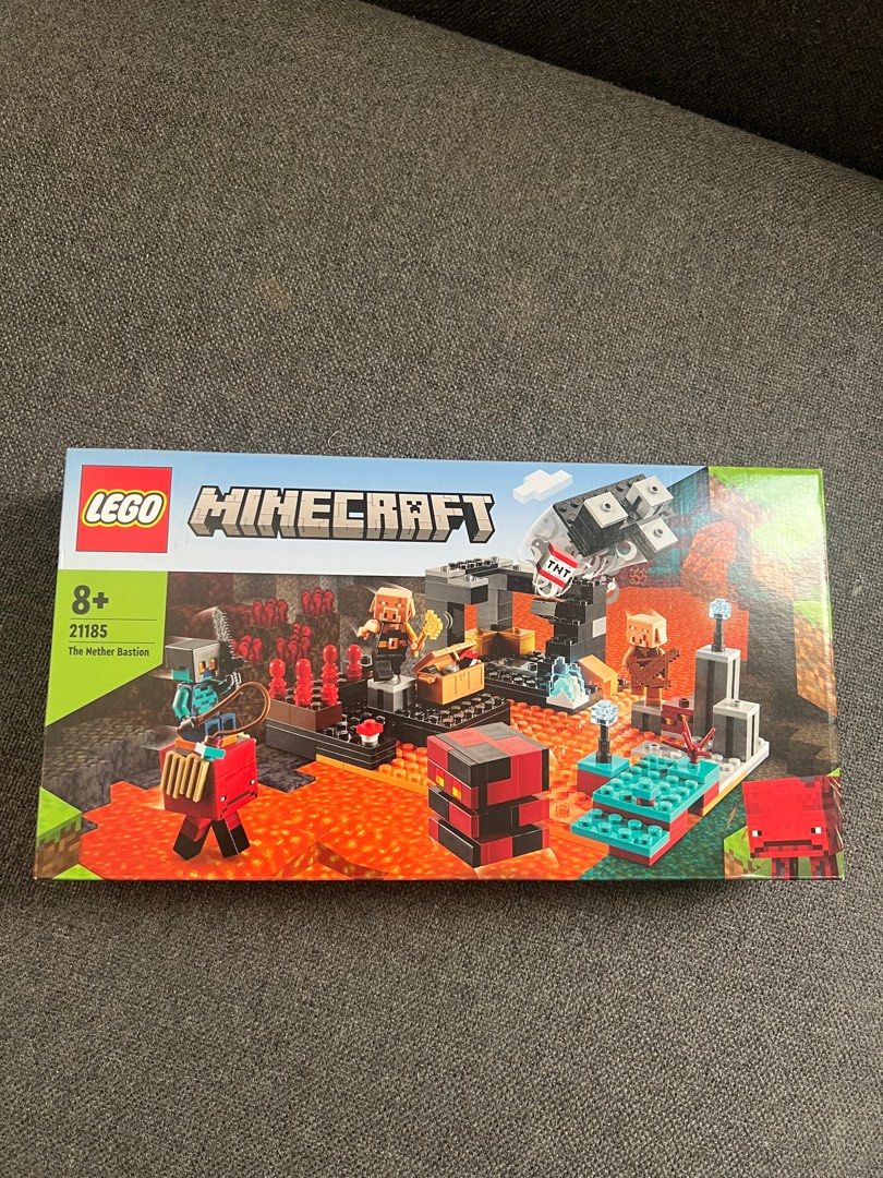LEGO Minecraft The Nether Bastion 21185 (Category: Lego & Building Sets) located in Quezon City. Submitted by authenticcloset (Listing ID 1406471080, Image 2). Description: - LEGO Minecraft The Nether Bastion set (21185). - Suitable for ages 8+. - Features Minecraft characters and elements. - Box shows contents, including figures and structures. - Back of box displays scene possibilities. Please check photos for the condition of the box .