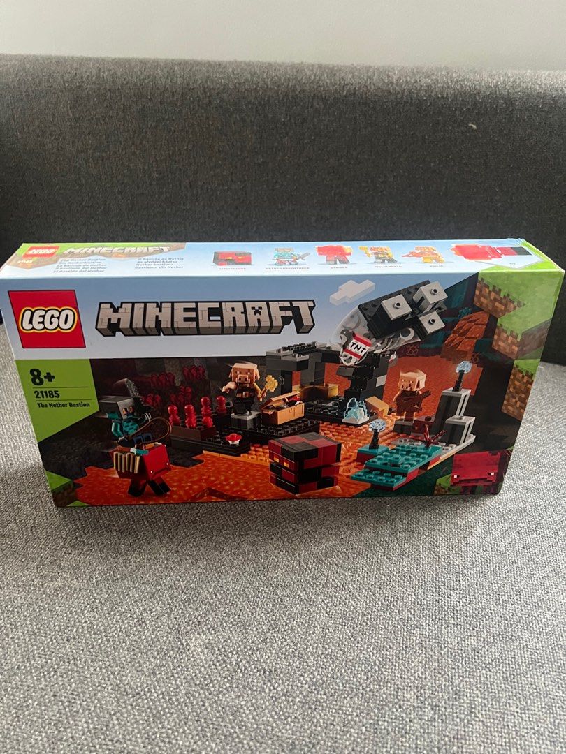 LEGO Minecraft The Nether Bastion 21185 (Category: Lego & Building Sets) located in Quezon City. Submitted by authenticcloset (Listing ID 1406471080, Image 1). Description: - LEGO Minecraft The Nether Bastion set (21185). - Suitable for ages 8+. - Features Minecraft characters and elements. - Box shows contents, including figures and structures. - Back of box displays scene possibilities. Please check photos for the condition of the box .