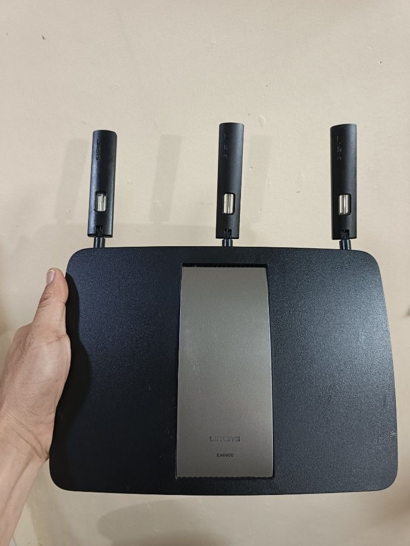 Linksys EA6900 Router (Category: Networking) located in Quezon City. Submitted by glempol-1 (Listing ID 1406551761, Image 2). Description: no issue The Linksys EA6900 is a dual-band AC1900 Wi-Fi router with speeds up to 1300 Mbps on the 5 GHz band and 600 Mbps on the 2.4 GHz band. It features four Gigabit LAN ports, a USB 3.0 port, and a USB 2.0 port for network storage or printers. The router includes Linksys Smart Wi-Fi for managing network set