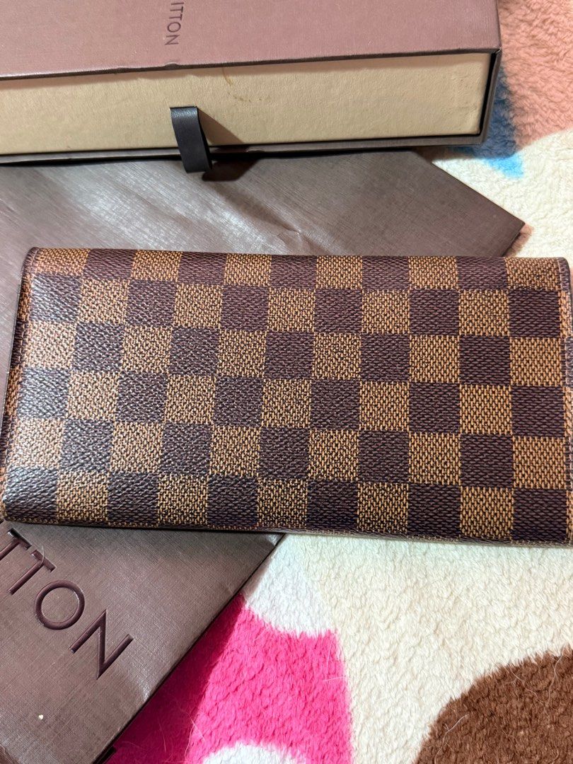 Louis Vuitton Emilie Damier Ebene Wallet (Category: Luxury Bags & Wallets) located in Pasig City. Submitted by chechitaco07 (Listing ID 1406523466, Image 2). Description: Original LV Emilie Damier Ebene Long Wallet Comes with box and paperbag Bought in LV Greenbelt Plus SF.