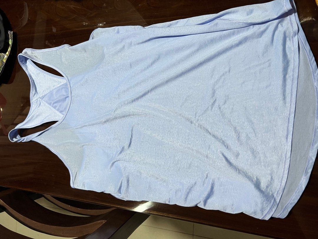 Lululemon Athletic Tank Top (Category: Activewear) located in Minalin. Submitted by Bagnetcharon (Listing ID 1406518218, Image 3). Description: - Lululemon athletic tank top - Light blue color - Racerback style - Made from lightweight, breathable material - Features the Lululemon logo - Curved hemline Used once! Original!.
