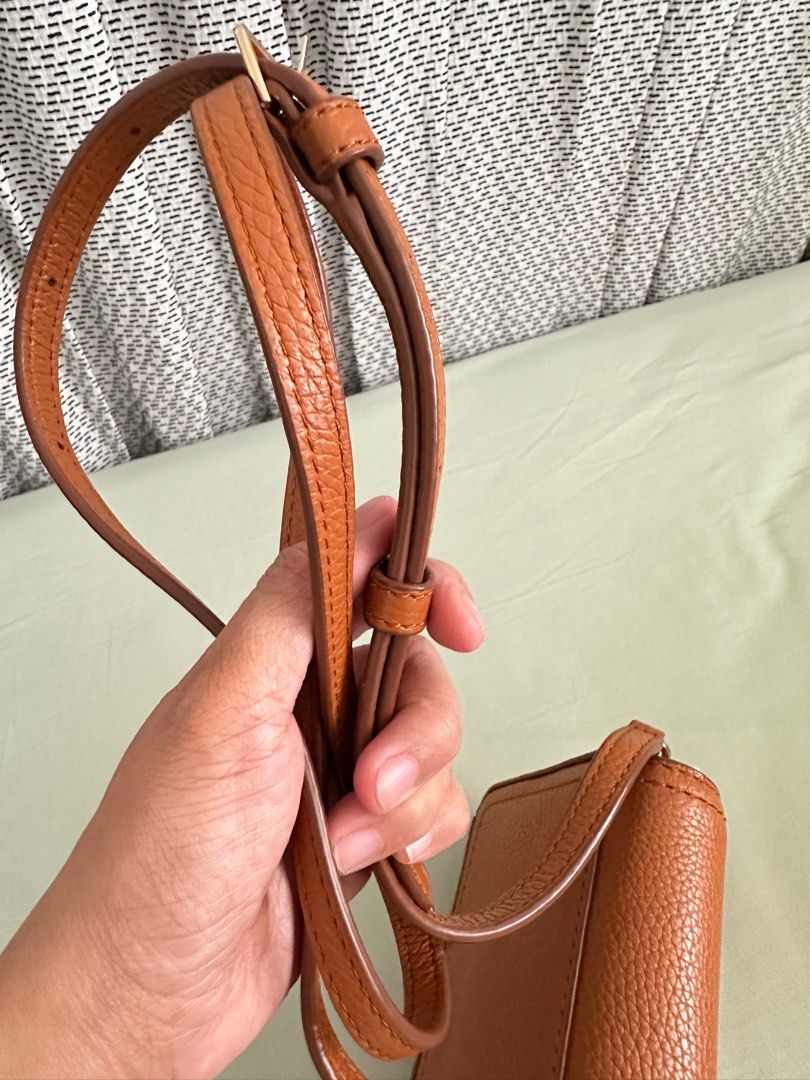 Marc Jacobs Groove Leather Mini Crossbody Bag (Category: Luxury Bags & Wallets) located in Cavite. Submitted by sayo_nato (Listing ID 1406540424, Image 2). Description: - Marc Jacobs Groove Mini Crossbody Bag - Brown leather exterior - White trim - Flap closure - Adjustable shoulder strap - Fabric-lined interior - Brand label inside - Perfect for everyday use.