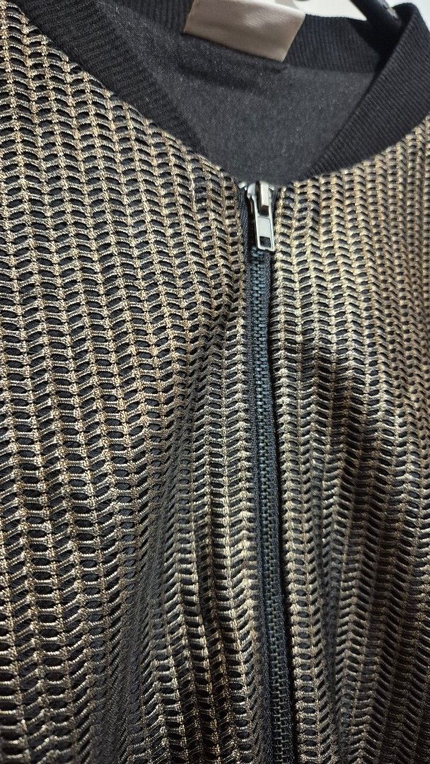 Matte Gold/Bronze and Black Bomber Zip Up Jacket (Category: Coats, Jackets and Outerwear) located in Manila. Submitted by gcuraming (Listing ID 1406495935, Image 2). Description: - Matte gold finish - Zip-up closure - Fits up to 36" bust - Stylish and elegant shipping from sampaloc manila or makati.