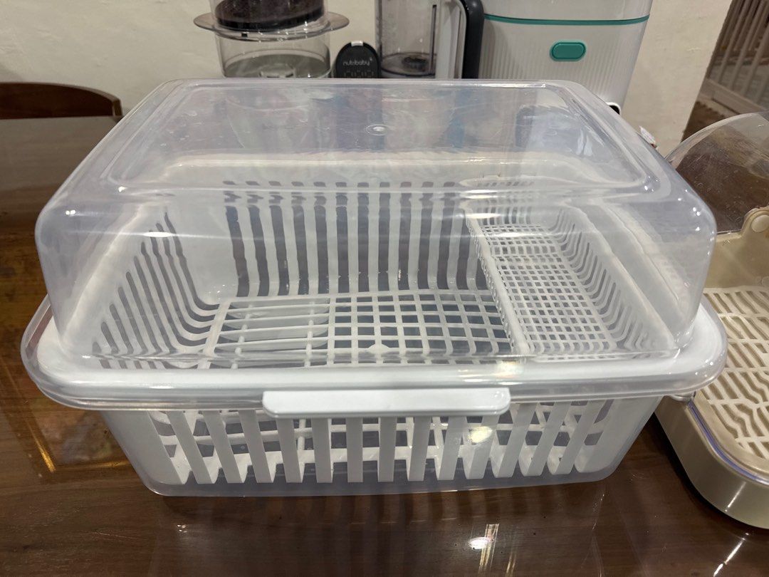 Megabox Covered Dish Rack (Category: Other Kitchenware & Tableware) located in Muntinlupa City. Submitted by goldinmygarage (Listing ID 1406635053, Image 1). Description: Used for a week lang while on travel Used with dry baby bottles Never po itong nabasa - White plastic dish rack - Clear cover to keep dishes clean - Main compartment for plates and bowls - Separate section for utensils - Practical for drying dishes and keeping your kitchen tidy.