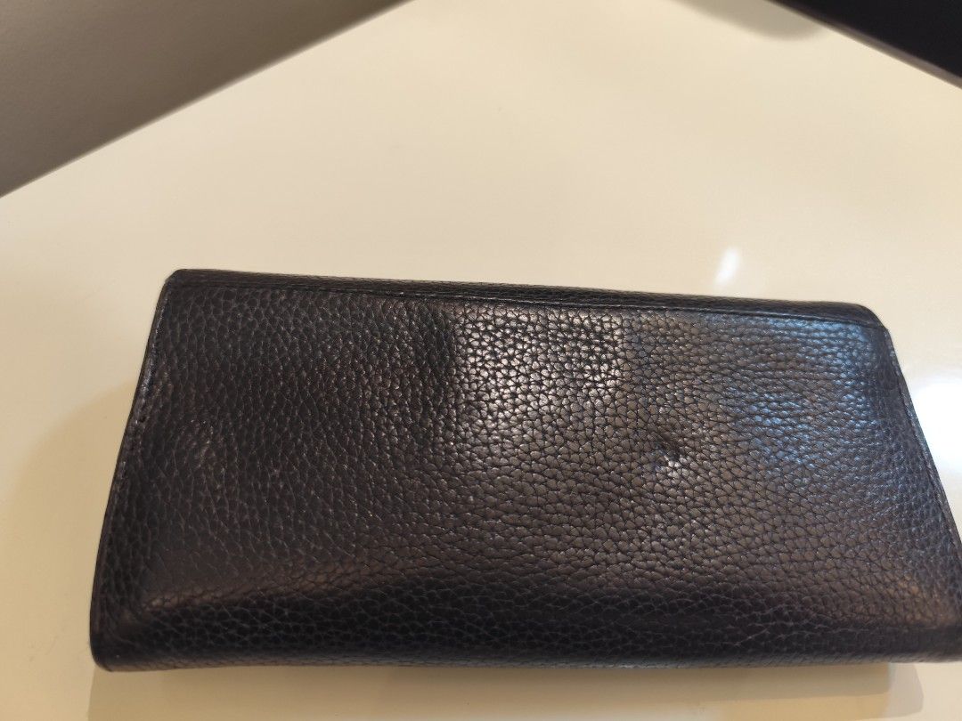 authentic Michael Kors Black Wallet (Category: Luxury Bags & Wallets) located in Manila. Submitted by nnnlim (Listing ID 1406507560, Image 3). Description: - Authentic Michael Kors wallet - Classic black color - Gold-tone MK logo - Multiple card slots - Zippered pocket for secure storage - Snap closure - Textured exterior finish - Michael Kors logo visible inside.