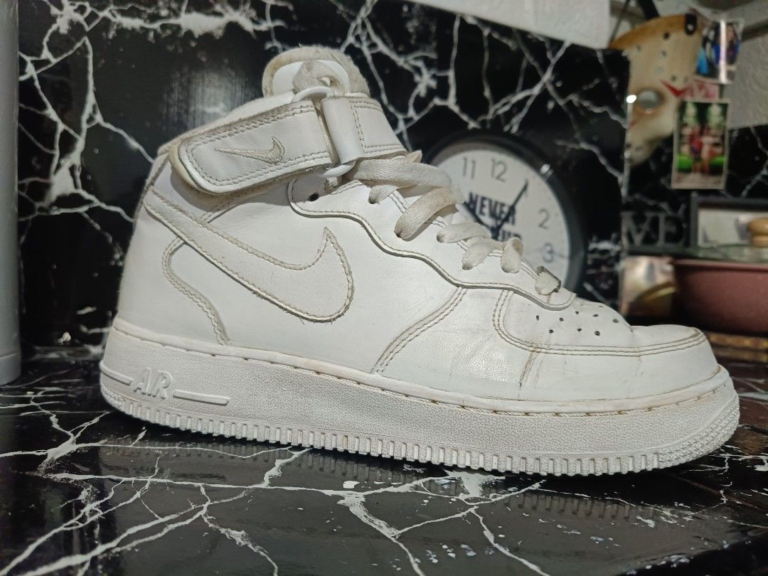 Nike Air Force 1 Mid 07 White (Category: Sneakers) located in Paranaque City. Submitted by RAK_thrift (Listing ID 1406479253, Image 3). Description: White Nike Air Force 1 Mid 07 sneakers. Features a mid-top design with a velcro strap. The shoes have a textured pattern on the upper and the iconic Nike swoosh on the sides. The size is US 7.5, UK 6.5, EUR 40.5, and 25.5 cm. The style code is 315123-111. issue: repaint mid sole negotiable.