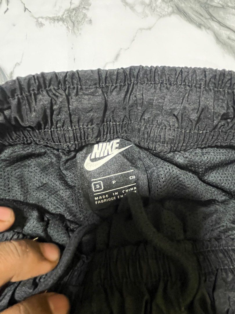 Nike Double Swoosh Track Pants - Black (Category: Joggers) located in Caloocan City. Submitted by yungbluhh (Listing ID 1406528742, Image 3). Description: - Black Nike track pants with grey side panels - Features Nike double swoosh logo on front - Smaller Nike logo on back - Elastic waistband and cuffs - Size: Small.
