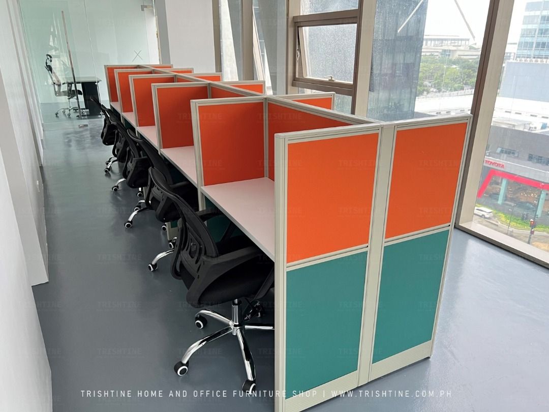 Office Cubicle with Chairs (Category: Office Furniture & Fixtures) located in Quezon City. Submitted by skyler-22 (Listing ID 1406545328, Image 1). Description: Office cubicle with multiple workstations. Each station includes a white desk and a black chair. Features orange and teal panels. Perfect for office setup. For other inquiry, you may contact the following furniture specialist: Reign Barrios .