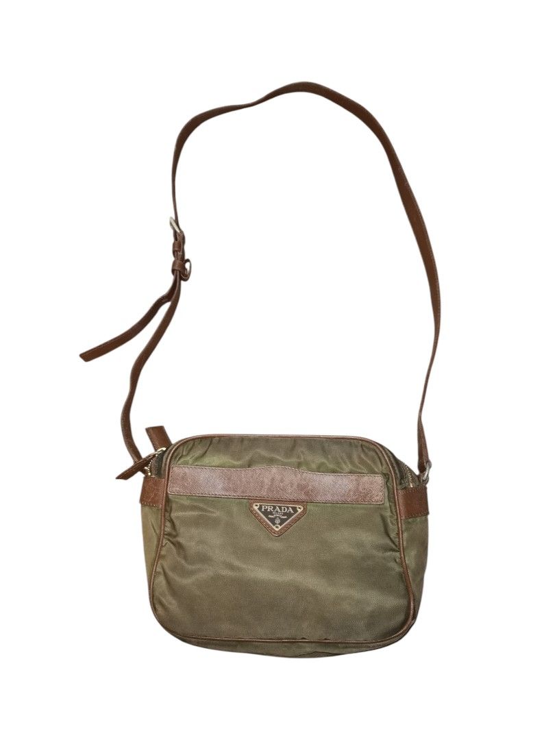 Prada Nylon Shoulder Bag (Category: Luxury Bags & Wallets) located in Manila. Submitted by eagerbeaverph (Listing ID 1406584209, Image 1). Description: Prada mini sling bag vintage Length 8 inches Height 6.5 Depth 4 With signs of usage Tear on the inner liner Small Tear on the front lower left One missing puller Please see detailed pics Dm me .