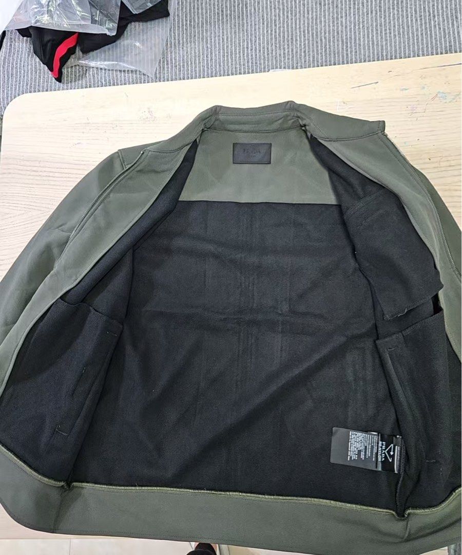 Prada Zip-Up Jacket (Category: Coats, Jackets and Outerwear) located in Angeles City. Submitted by caerus8 (Listing ID 1406590347, Image 3). Description: Brand new. Wrong size for me. See size M from the last photo for the size guide. Price is still negotiable..