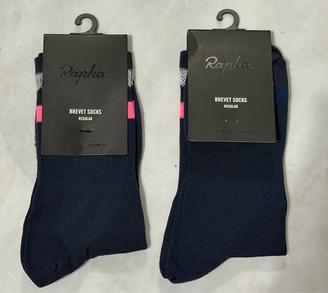 Rapha Reflective Brevet Socks Regular (Category: Socks) located in Taguig. Submitted by c00lafu (Listing ID 1406533247, Image 1). Description: - Rapha Brevet Socks - Color: Navy blue with pink and grey stripe - Made in Italy - Material: Merino wool blend - Sizes: Small, Medium - Designed for performance Both brand new - removed the medium ine just to check the actual socks and its reflective strip 1,400 each 2,000 for both.