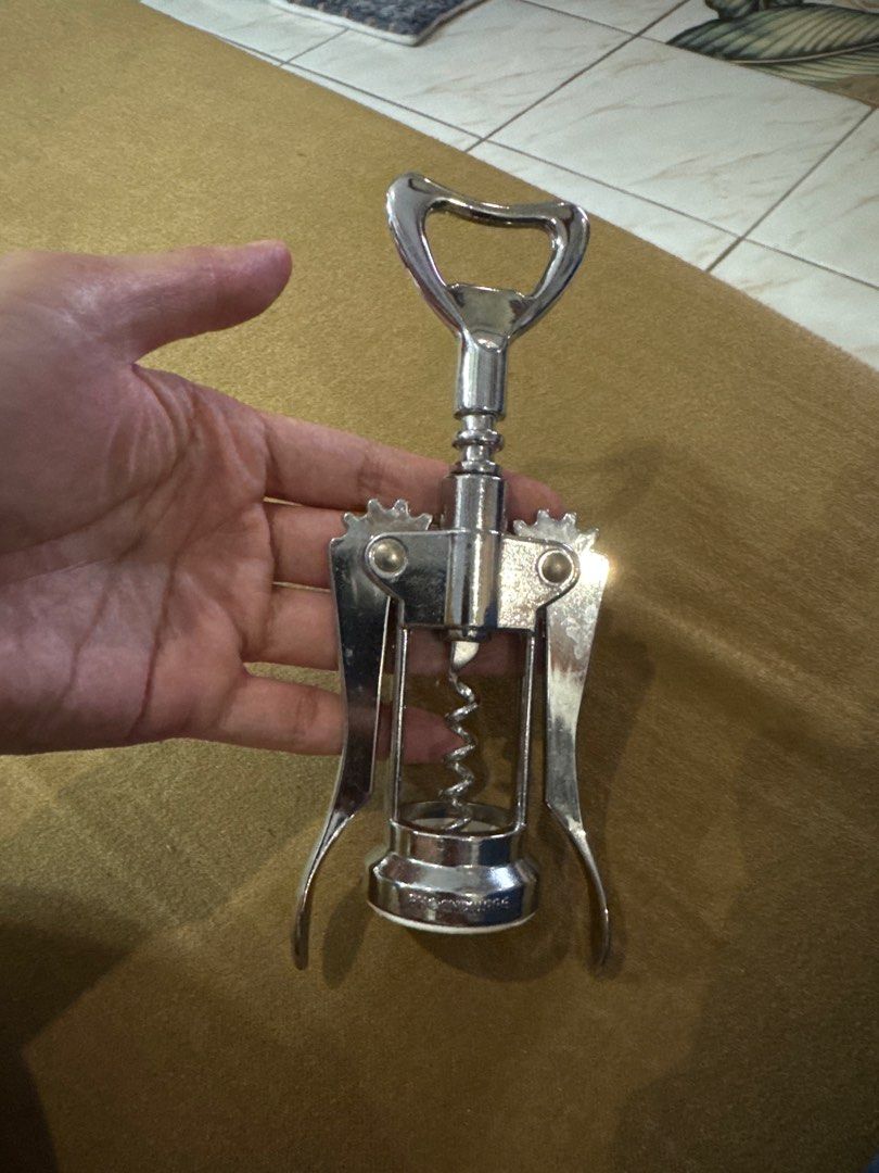 Stainless Steel Corkscrew (Category: Other Kitchenware & Tableware) located in Pasay City. Submitted by mscaoo (Listing ID 1406557122, Image 1). Description: - Stainless steel corkscrew for easy wine bottle opening. - Lever mechanism for effortless cork removal. - Includes a convenient bottle opener. - Made of durable metal for regular use. - Compact and easy to store..
