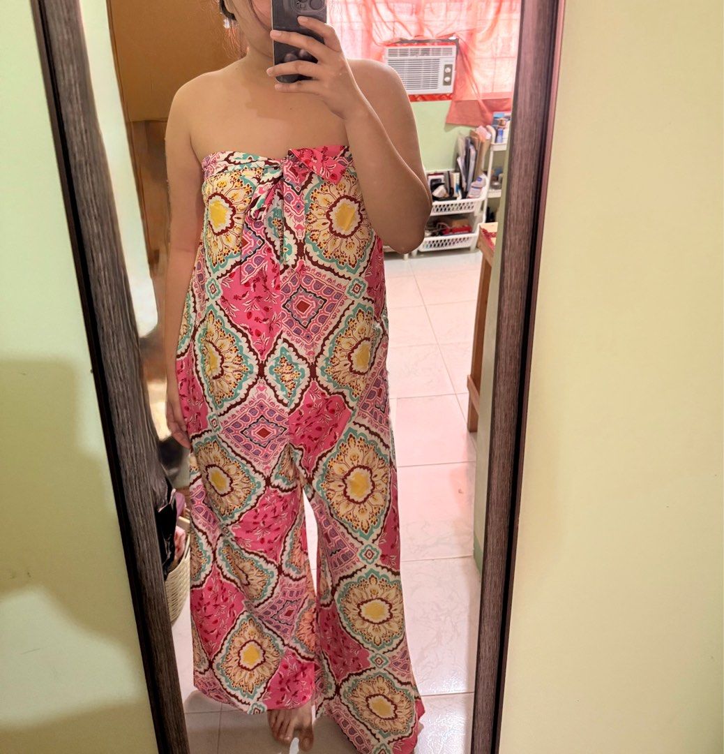 Strapless Printed Jumpsuit (Category: Dresses) located in Lucena. Submitted by lcndeclutter (Listing ID 1406509505, Image 1). Description: - Strapless jumpsuit - Vibrant, colorful print - Wide-leg design - Tie detail at bust - Lightweight fabric - One-piece garment - Easy to wear and style - Ideal for warm weather.