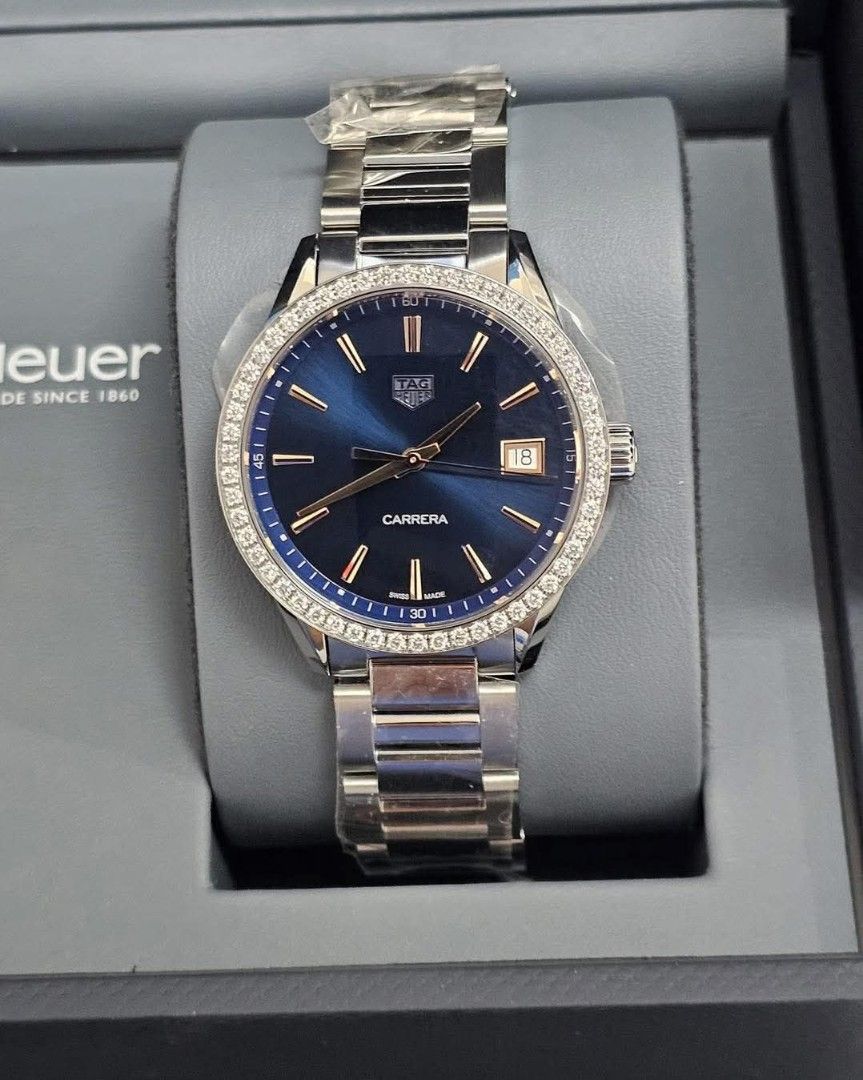 TAG Heuer Carrera Diamond Bezel Watch (Category: Luxury Watches) located in Manila. Submitted by maricelbal37348 (Listing ID 1406572628, Image 2). Description: - TAG Heuer Carrera watch - Stunning blue dial - Diamond-encrusted bezel - Stainless steel bracelet - Date display - Includes original box and documentation - Perfect for any occasion 101% ORIGINAL Tag Heuer Carrera Model Wbk-1317 Real Diamonds 36mm 5x money back if fake 2 years warranty s