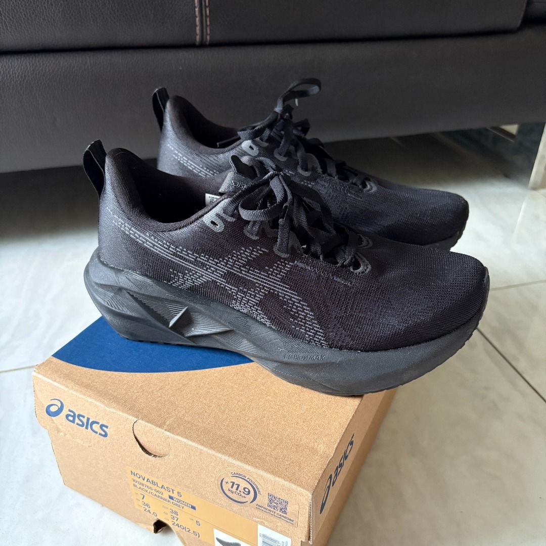 Asics Novablast 5 Black / Carrier Grey Running Shoes (Category: Sneakers) located in Singapore. Submitted by mitokki (Listing ID 1406765908, Image 3). Description: Authentic Asics Novablast 5 running shoes. In like new condition, only worn once to try but realised it's a tad too small for me. The Novablast 5 is designed for everyday running and great as a daily trainer. Has a midsole foam that provides good cushioning for long runs. Bough at $219