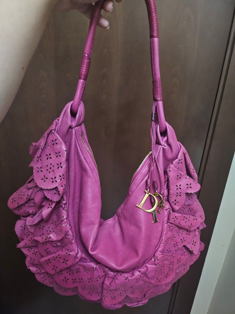 Authentic Dior Pink Leather Gypsy Ruffle Hobo (Category: Luxury Bags & Wallets) located in Antipolo. Submitted by frostymmer (Listing ID 1406802792, Image 1). Description: Authentic Dior Pink Leather Gypsy Ruffle Hobo With gold Dior letter charms Bag only - no inclusion Make space in your closet for this gorgeous Dior Gypsy hobo. The pretty pink bag is skilfully crafted from leather into a ruffled design that is truly feminine. It comes with the 
