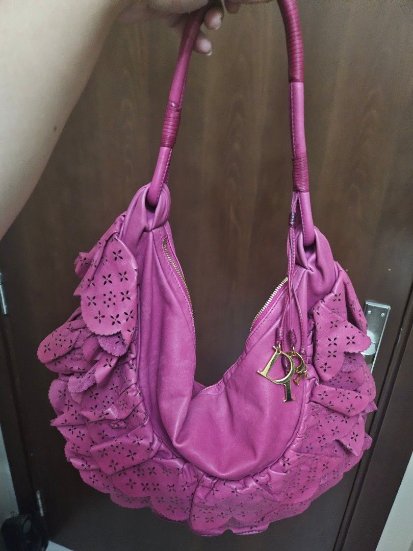 Authentic Dior Pink Leather Gypsy Ruffle Hobo (Category: Luxury Bags & Wallets) located in Antipolo. Submitted by frostymmer (Listing ID 1406802792, Image 2). Description: Authentic Dior Pink Leather Gypsy Ruffle Hobo With gold Dior letter charms Bag only - no inclusion Make space in your closet for this gorgeous Dior Gypsy hobo. The pretty pink bag is skilfully crafted from leather into a ruffled design that is truly feminine. It comes with the 