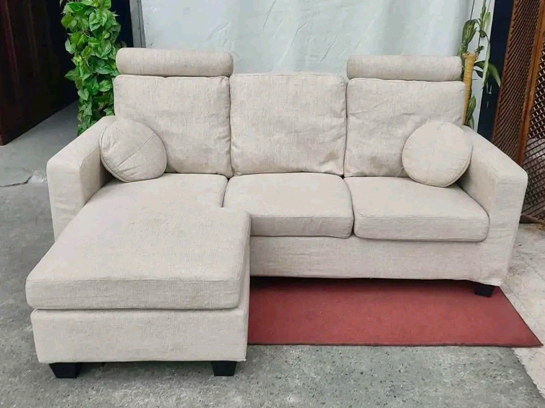 Beige L-Shaped Sofa with Ottoman (Category: Sofas) located in Manila. Submitted by eloizavill76462 (Listing ID 1406673914, Image 2). Description: Modular L-Shape Sofa 77”L x 58”W x 16”SH Fully washable Removable headrest In good condition.