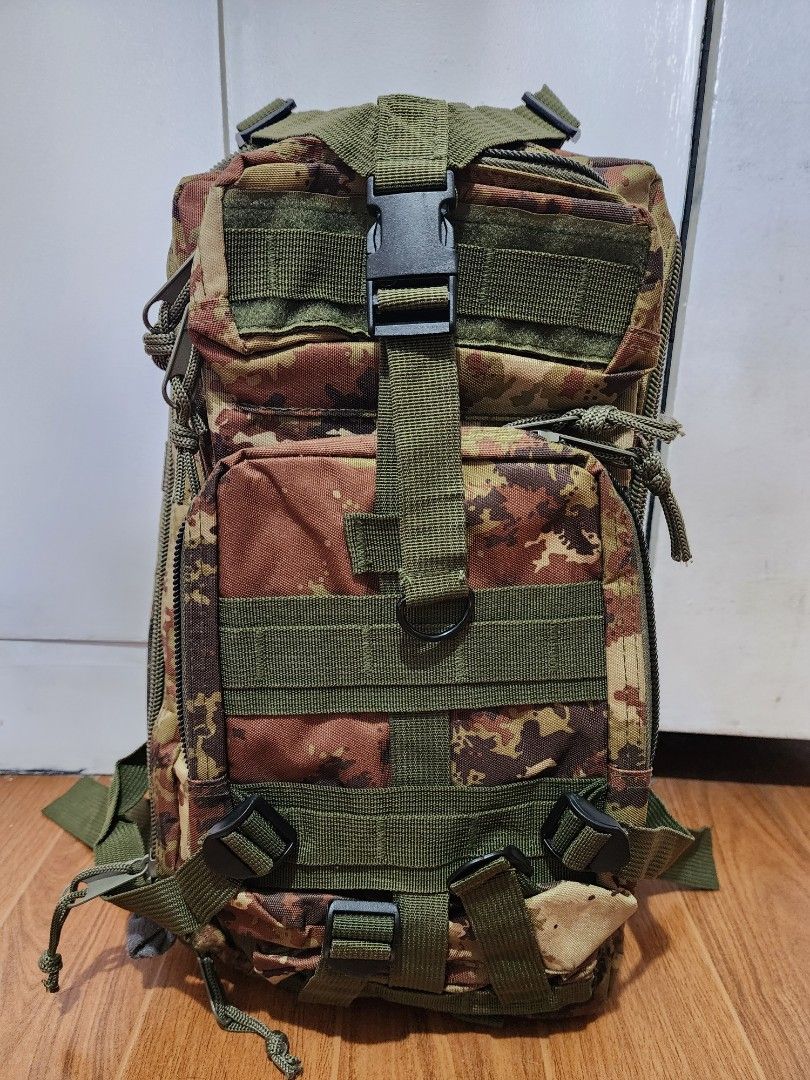 Camouflage Tactical Backpack (Category: Backpacks) located in Meycauayan. Submitted by MP_Shop (Listing ID 1406685921, Image 1). Description: - Camouflage pattern - Multiple compartments and zippered pockets - Adjustable straps and buckles - Top handle for carrying - Interior pockets (mesh and zippered) - Durable construction - Suitable for outdoor activities Size: 11W x 18L inches Excellent Condition Color rate: 10/10 850 + sf Loc: Meycauayan Bu
