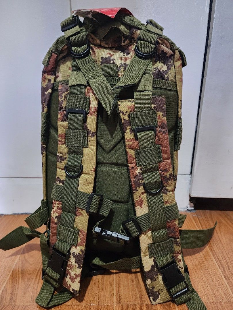 Camouflage Tactical Backpack (Category: Backpacks) located in Meycauayan. Submitted by MP_Shop (Listing ID 1406685921, Image 3). Description: - Camouflage pattern - Multiple compartments and zippered pockets - Adjustable straps and buckles - Top handle for carrying - Interior pockets (mesh and zippered) - Durable construction - Suitable for outdoor activities Size: 11W x 18L inches Excellent Condition Color rate: 10/10 850 + sf Loc: Meycauayan Bu