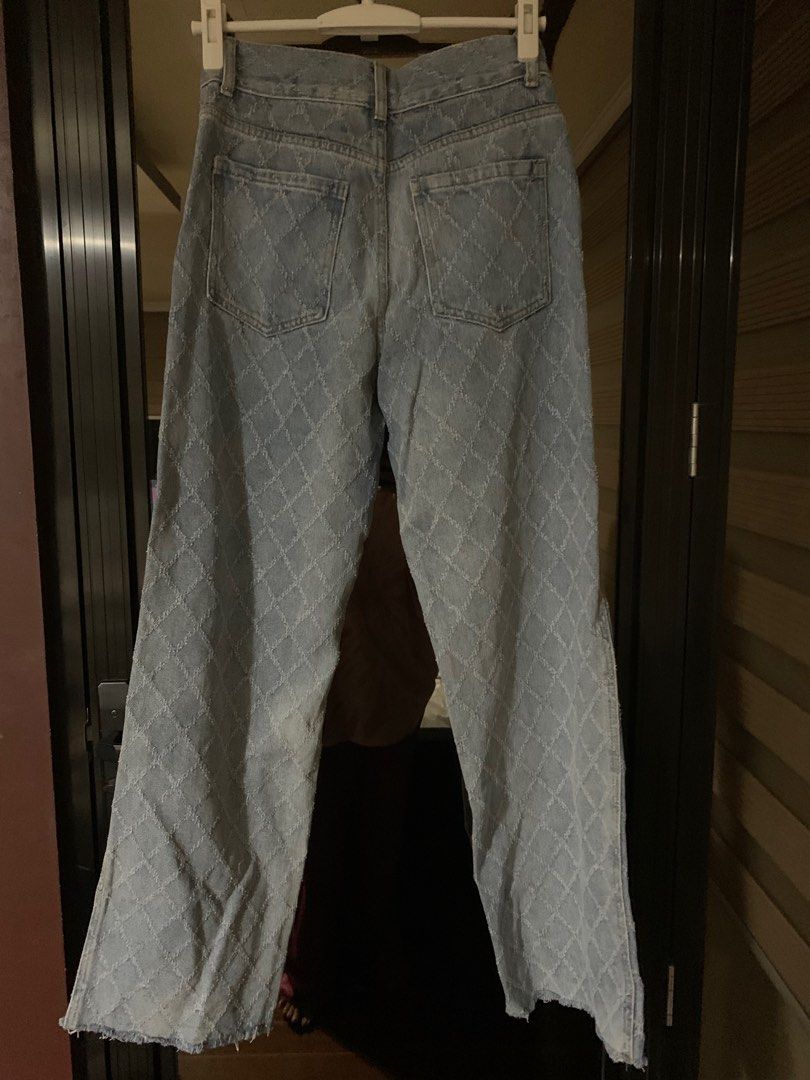 Chanel Diamond Pattern Jeans (Category: Luxury Apparel) located in Bulacan. Submitted by love2loved (Listing ID 1406770686, Image 3). Description: Stylish Chanel jeans featuring a unique diamond pattern. These jeans have a classic five-pocket design with a button and zipper closure. The jeans have a straight leg cut and are made of denim. The size is S. The jeans have a light blue color. The jeans have Chanel logo on the label. 28 to 29 inches wa