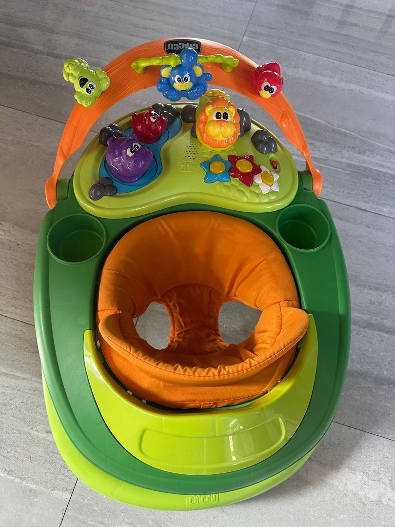Chicco Baby Walker (Category: Infant Playtime) located in Angeles City. Submitted by shopmycloset_101 (Listing ID 1406648747, Image 2). Description: - Chicco baby walker - Bright green and orange design - Padded seat for comfort - Includes cup holders - Features an activity center with toys - Helps babies learn to walk.