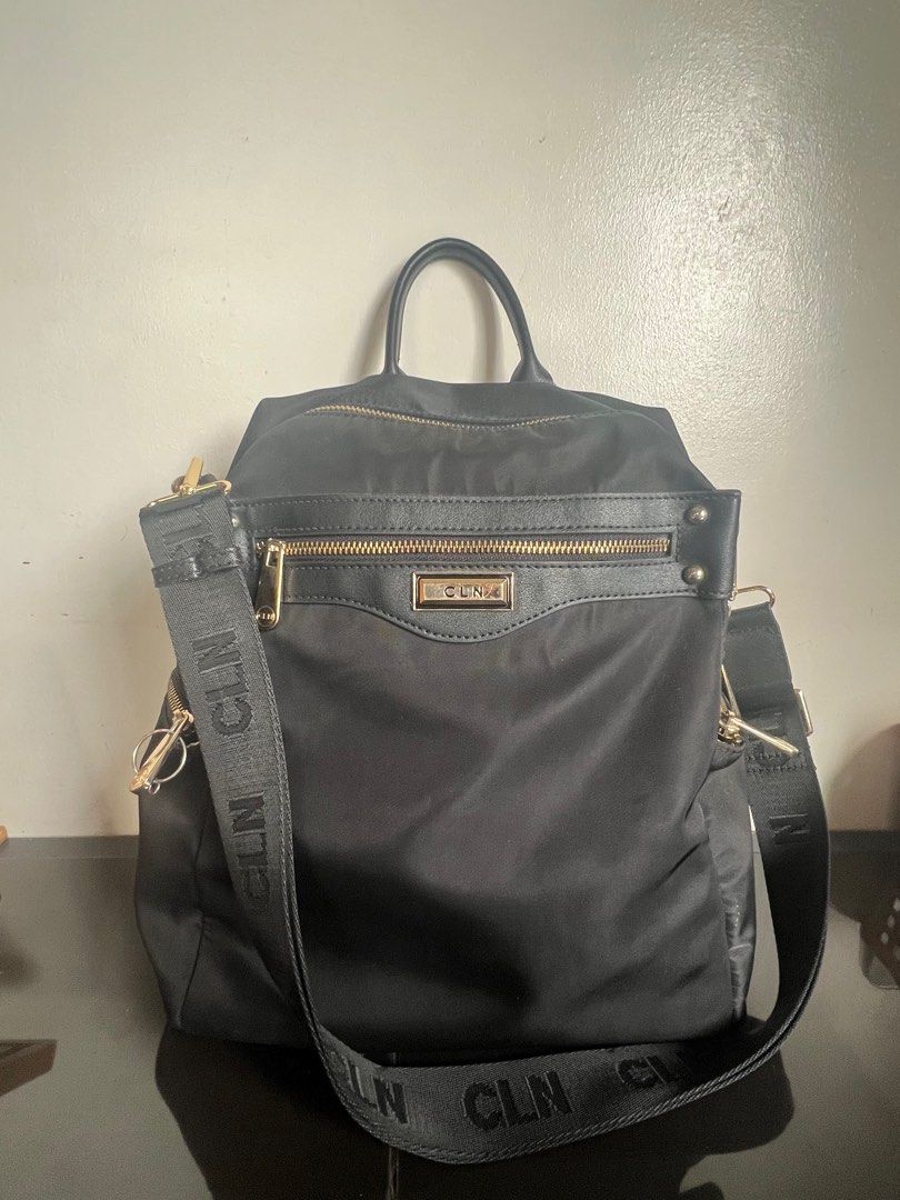 CLN Achazia Black Nylon Backpack (Category: Backpacks) located in Tuguegarao City. Submitted by aimurmere (Listing ID 1406689309, Image 2). Description: CLN Achazia backpack in black nylon with gold-tone hardware Orig Price: ₱2650 Two-way backpack with zip-around closure, padded laptop compartment fits up to 11.50” with velcro strap closure, 2 interior slip pockets, interior zipper pocket, 4 exterior zipper pockets, adjustable shoulder straps, Ny