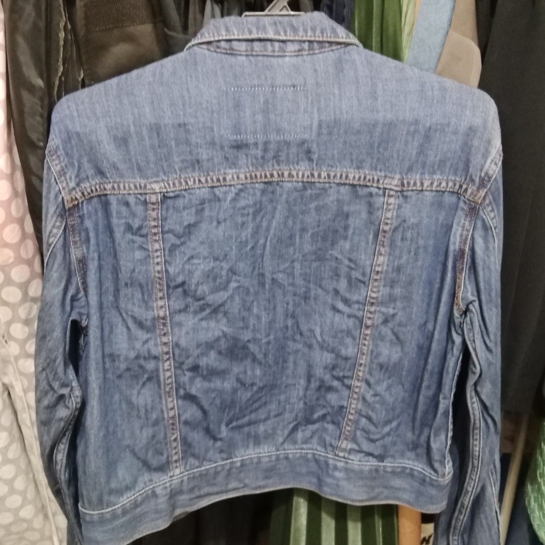 Denim Jacket (Category: Coats, Jackets and Outerwear) located in Shah Alam. Submitted by anyactr (Listing ID 1406791913, Image 3). Description: - Classic denim jacket - Medium wash - Button closure - Two chest pockets - Two side pockets - Standard collar - Long sleeves - Regular fit.