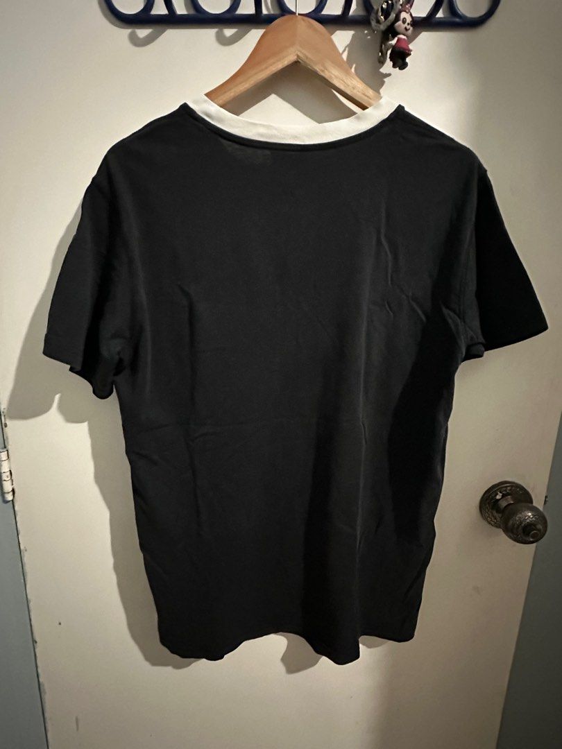 Dior Black T-shirt with White Collar (Category: Tshirts & Polo Shirts ) located in Cavite. Submitted by jessrms (Listing ID 1406657577, Image 3). Description: - Authentic Dior T-shirt - Color: Black with white collar - Features a Dior logo patch - Size: L - Material: 100% Cotton - Made in Italy.