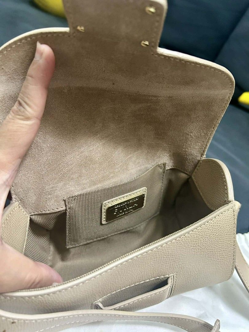 Authentic Furla Metropolis Crossbody Bag (Category: Luxury Bags & Wallets) located in Manila. Submitted by sterling_grace (Listing ID 1406764712, Image 2). Description: - Furla Metropolis crossbody bag - Neutral beige color - Flap closure with gold-tone clasp - Detachable shoulder strap - Interior pocket with Furla label - Includes Furla dust bag.