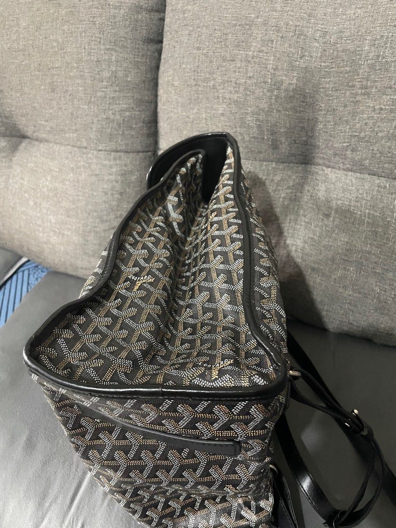 Goyard Saint Leger Backpack (Category: Luxury Bags & Wallets) located in Naga. Submitted by thriftboss88 (Listing ID 1406652882, Image 3). Description: - Goyard 3way Saint Leger Backpack - Signature black and brown Goyardine pattern - Includes top handle and detachable strap - Interior lined with orange fabric - Multiple pockets - Made in France -Minor Flaw ( one of the Strap has a Damage on the edging. See pics..