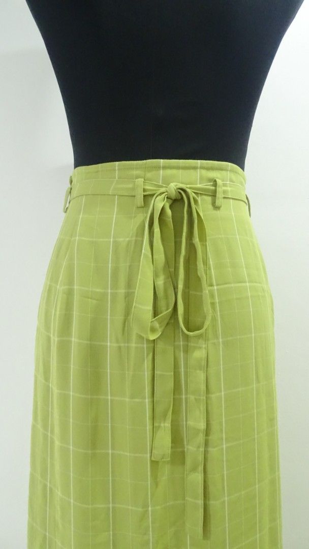 Green Checkered Wrap Skirt (Category: Skirts) located in Bulacan. Submitted by aarchive (Listing ID 1406654894, Image 2). Description: Can fit Small to Medium MOP: Gcash/MAYA/BPI Shipping fee is shouldered by Buyer. Courier: J&T/Lalamove.