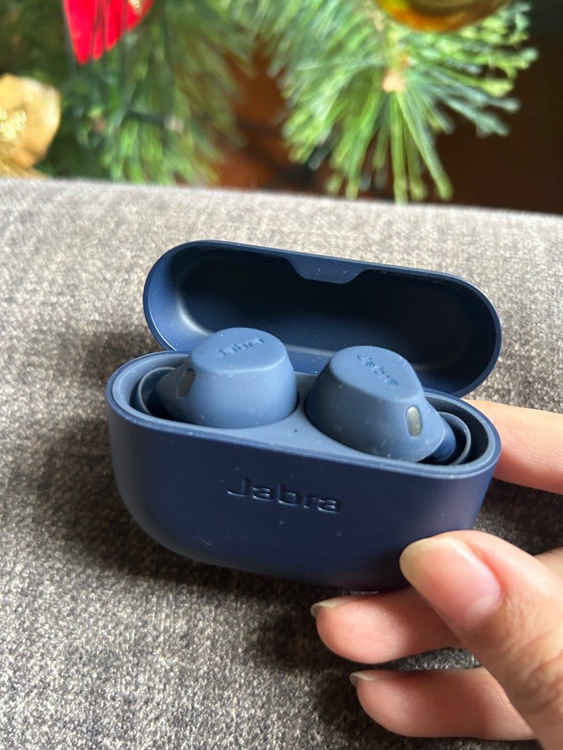 Jabra Earbuds (Category: Earphones) located in Labrador. Submitted by kharen_1988 (Listing ID 1406757730, Image 2). Description: - Dark blue Jabra earbuds - Includes charging case - Jabra logo on case - Both earbuds and case are dark blue.