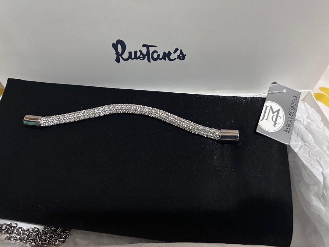 Jessica McClintock Black Clutch Bag (Category: Clutches) located in Manila. Submitted by vibeandcart (Listing ID 1406812665, Image 2). Description: - Jessica McClintock black clutch bag - Sparkling rhinestone handle - Detachable silver chain - Magnetic closure - Spacious interior - Includes original box from Rustan's - Ideal for special events.