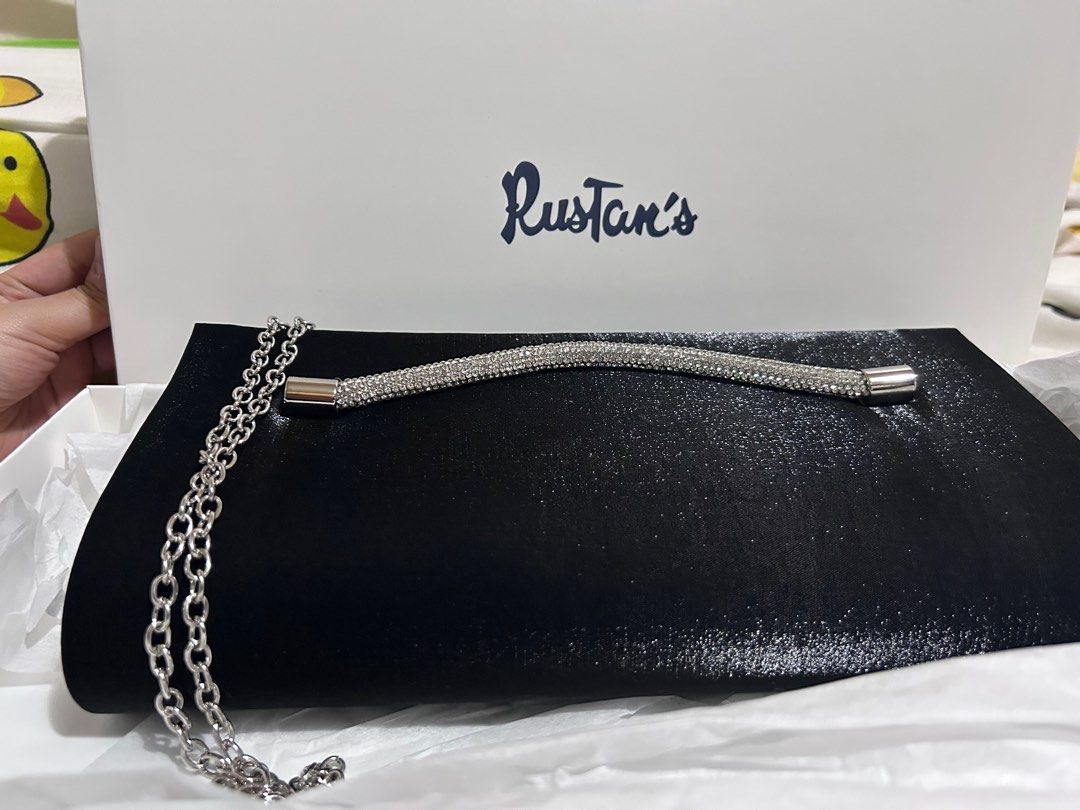 Jessica McClintock Black Clutch Bag (Category: Clutches) located in Manila. Submitted by vibeandcart (Listing ID 1406812665, Image 1). Description: - Jessica McClintock black clutch bag - Sparkling rhinestone handle - Detachable silver chain - Magnetic closure - Spacious interior - Includes original box from Rustan's - Ideal for special events.