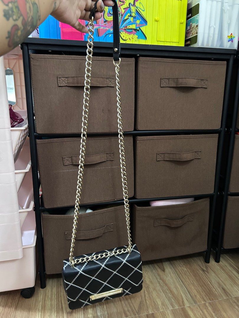 Kate Spade New York Black Chain Bag (Category: Luxury Bags & Wallets) located in Manila. Submitted by mhainers (Listing ID 1406652164, Image 2). Description: - Authentic Kate Spade 2 way bag - Shoulder & handbag - White stitching detail - Pink fabric interior lining - Flap closure - Chain and leather strap - Classy & Elegant style - bought in Singapore (hindi maxado nagamit).
