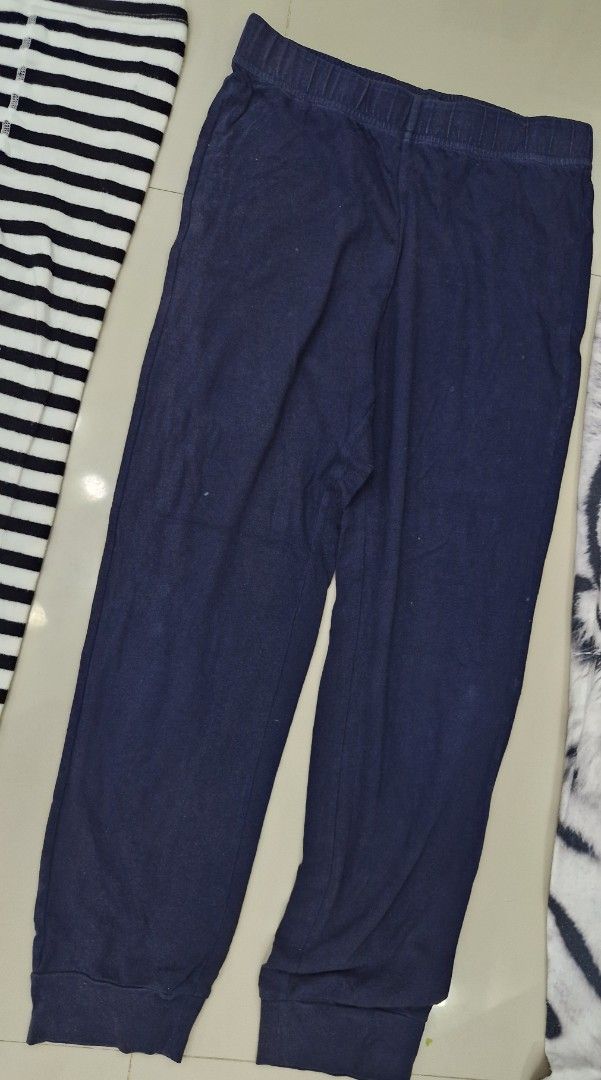 Kids' Assorted Pants (Category: Babies & Kids Fashion) located in Malolos. Submitted by prelovedclothes_stuff (Listing ID 1406751616, Image 3). Description: Set of kids' pants in various designs. Includes a pair of grey pants with black polka dots, striped leggings with yellow accents, navy blue pants, and a pair of white tiger print pants. All pants appear to be made of a soft, comfortable material. Perfect for everyday wear..