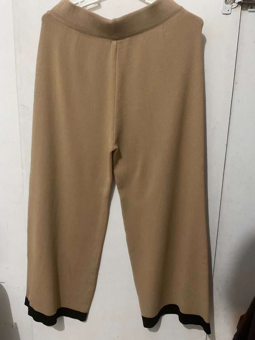 Korean Knitted Vest and Pants Set (Category: Sets or Coordinates) located in Cebu City. Submitted by beam.arielle (Listing ID 1406797942, Image 2). Description: - Knitted vest and pants set - Beige color - Vest: V-neck, black trim, button closure - Pants: Wide-leg, black hem trim - Perfect for a chic and comfortable look.