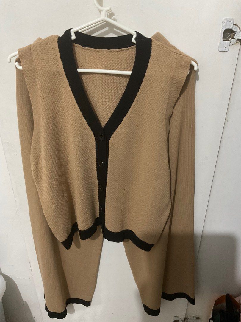 Korean Knitted Vest and Pants Set (Category: Sets or Coordinates) located in Cebu City. Submitted by beam.arielle (Listing ID 1406797942, Image 3). Description: - Knitted vest and pants set - Beige color - Vest: V-neck, black trim, button closure - Pants: Wide-leg, black hem trim - Perfect for a chic and comfortable look.