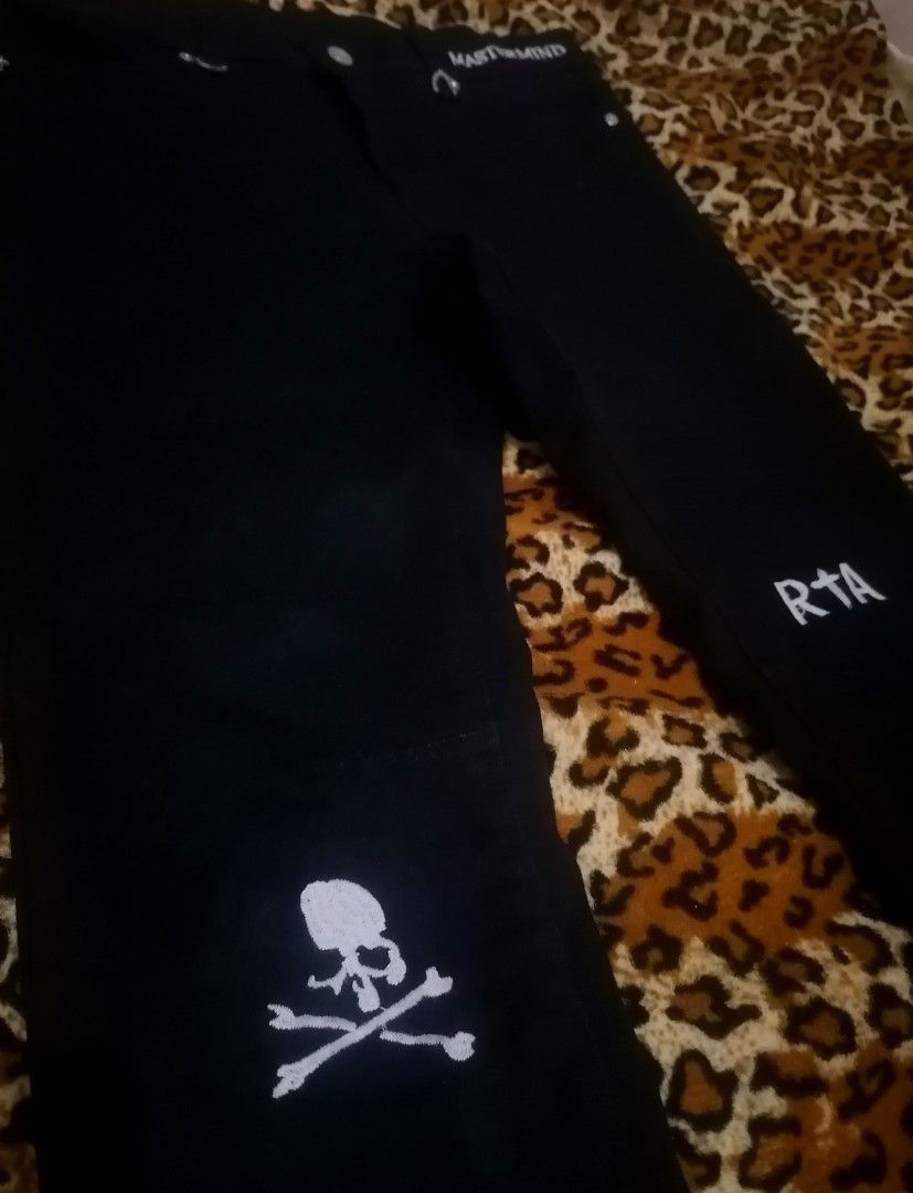 Mastermind World RTA Black Jeans (Category: Jeans) located in Cebu City. Submitted by roadthrift (Listing ID 1406767618, Image 2). Description: - Black jeans with Mastermind World and RTA branding. - Features a skull and crossbones design on the front. - Includes white cross details and RTA branding on the back. - Made in Los Angeles. - Crafted from 100% cotton..